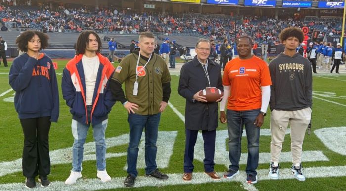 Athletic Director with fans and heroes